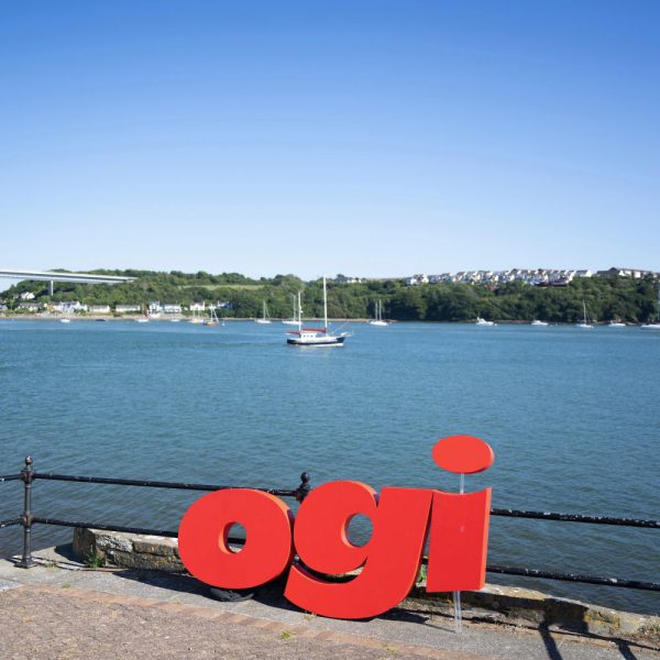 Ogi-Logo-with-Wales-Coastline-in-Background