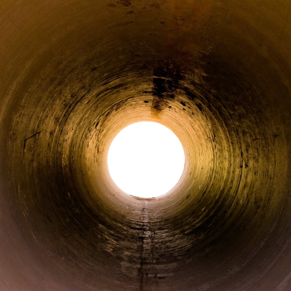 A view through a tunnel / pipe – isolated opening